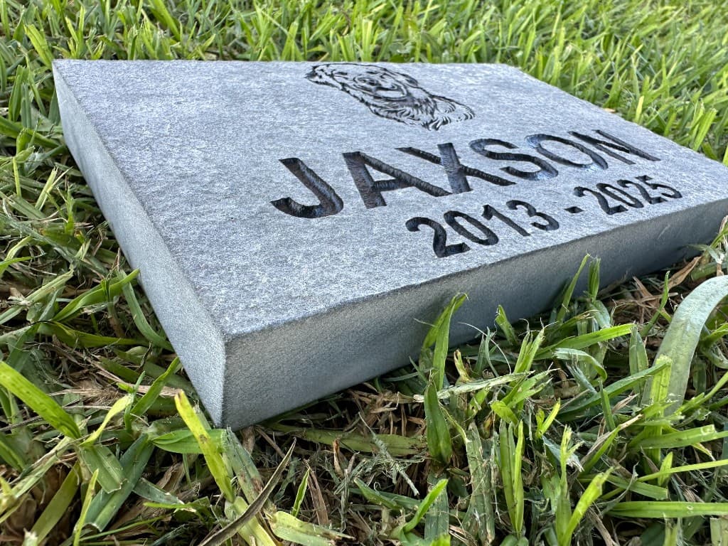 Engraved stone pet memorial with portrait and dates — representative of My Furever Memories craftsmanship.