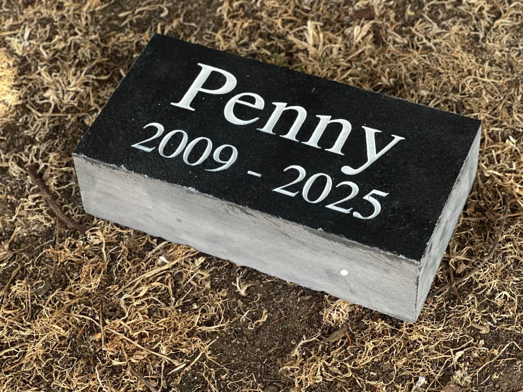 Outdoor engraved stone memorial — representing the lasting, personal pieces our design tools help families create.